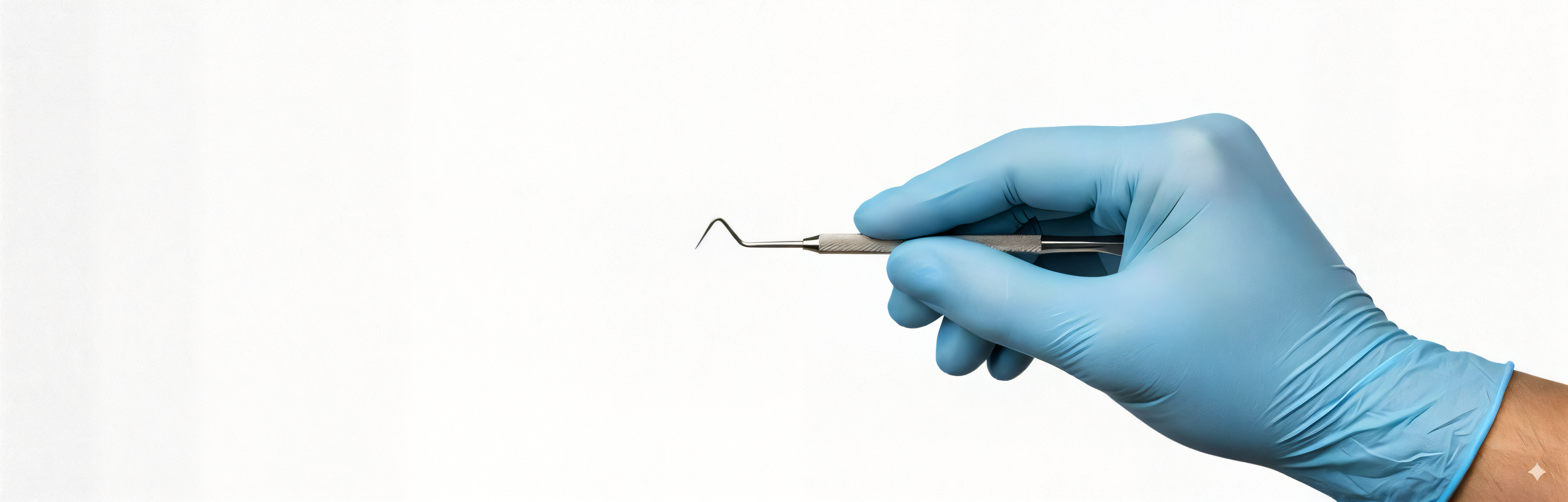 Hand wearing blue Schneider VSFB30 Vinyl Gloves while holding a dental tool